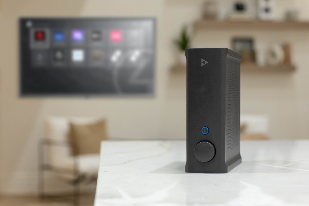 A sleek and modern audio setup featuring Triad amplifiers and speakers, showcased in a well-lit, contemporary living room setting. In the foreground, a pair of Triad tower speakers stand tall, their metallic grilles and clean lines exuding a premium, high-end aesthetic. The amplifiers, perhaps a Triad AMP Series model, are neatly arranged nearby, their sturdy and streamlined design complementing the speakers. The middle ground features a minimalist entertainment console, providing a harmonious backdrop for the audio equipment. The room is bathed in warm, soft lighting, creating a cozy and inviting atmosphere, perfect for an immersive audio-visual experience.